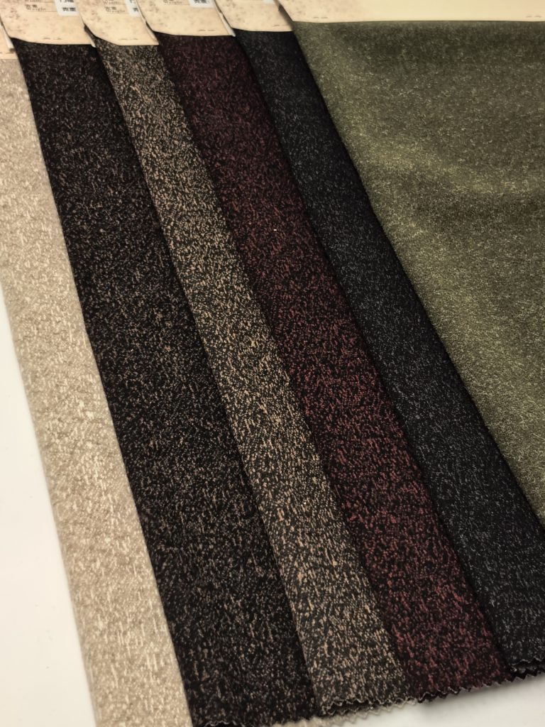 Various colored fabric swatches displayed.