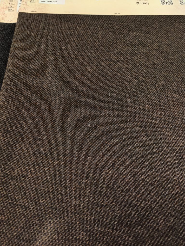 Textured brown fabric swatch.