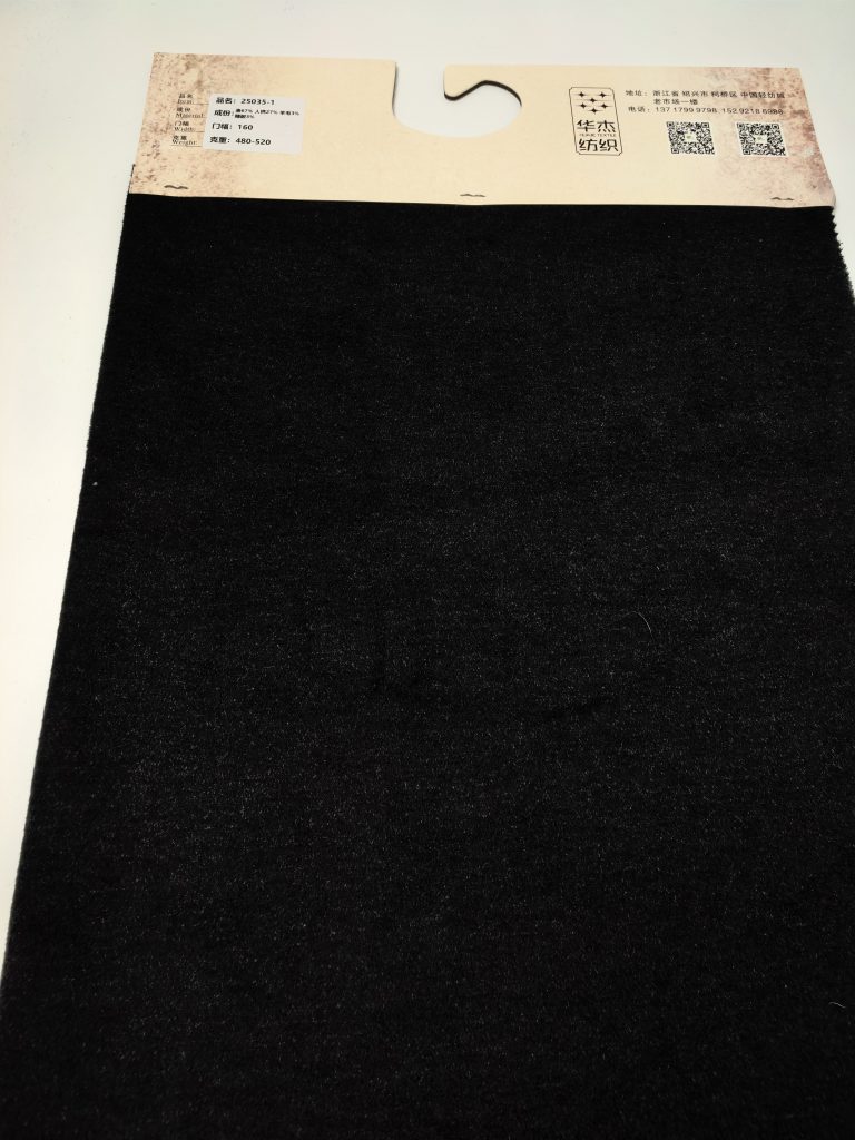 Classic Mélange Brushed Fleece Heavyweight Fabric — Style 25035 3 Solid black fabric with label