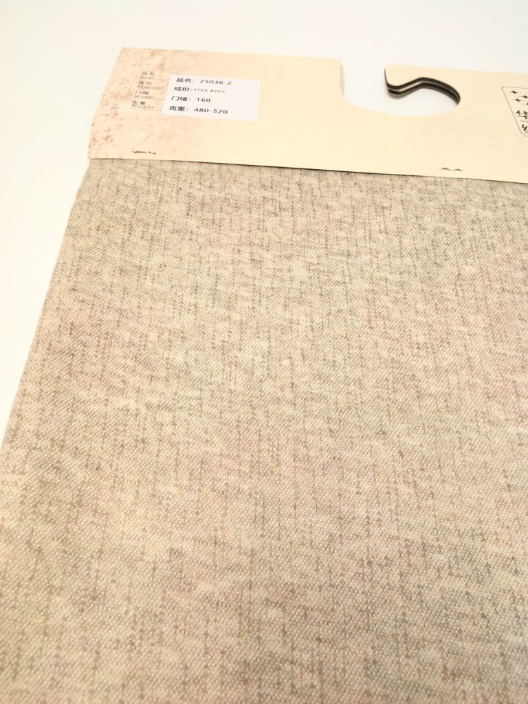 Textured fabric sample with label